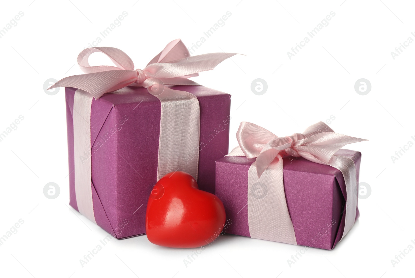 Photo of Beautiful gift boxes and red heart on white background. Valentine's Day celebration