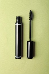 Mascara for eyelashes on light background, flat lay. Makeup product