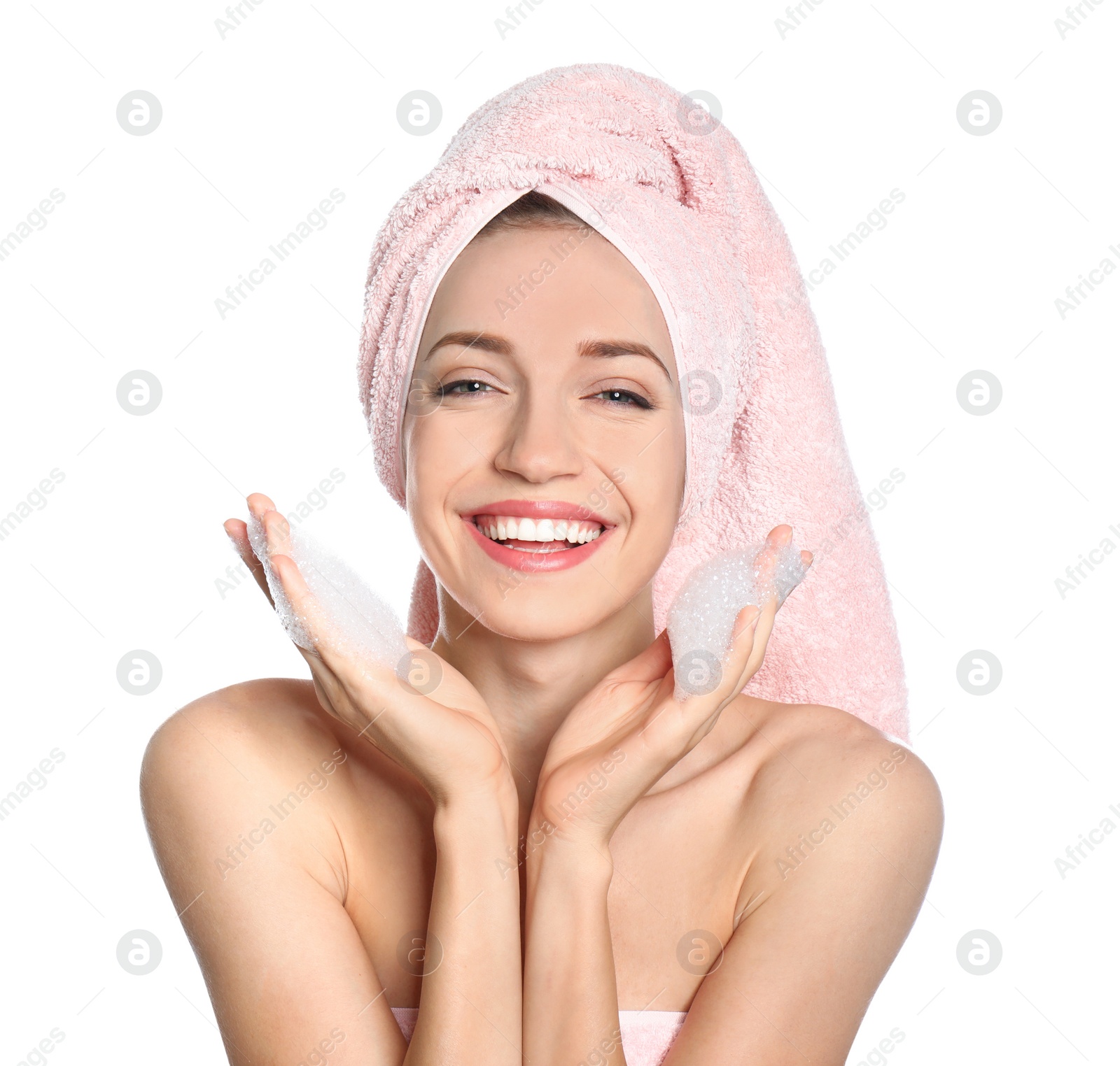 Image of Young woman washing face with soap foam on white background