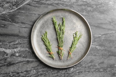 Photo of Flat lay composition with rosemary on table. Aromatic herbs