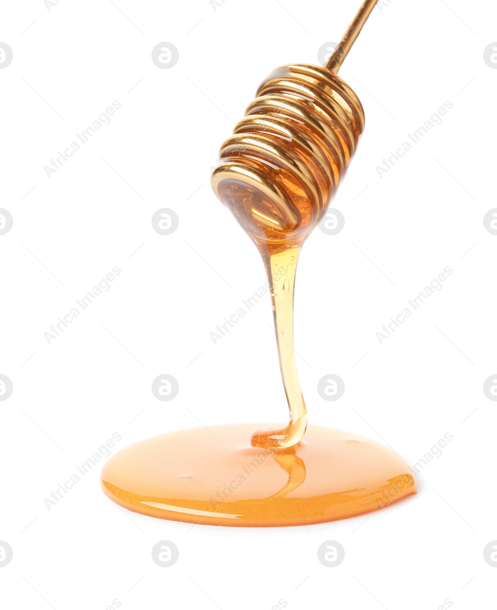 Photo of Honey dripping from dipper on white background