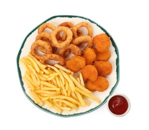 Tasty chicken nuggets, french fries, fried onion rings and ketchup on white background, top view