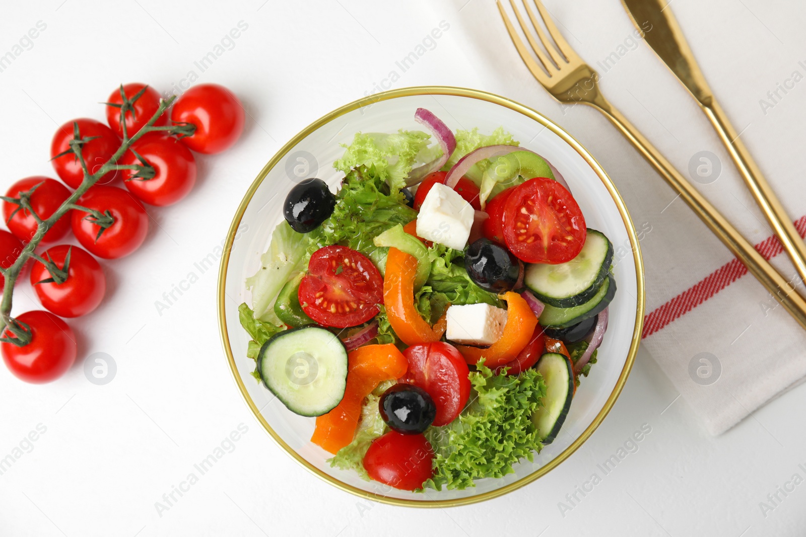 Photo of Tasty fresh Greek salad on white background, top view