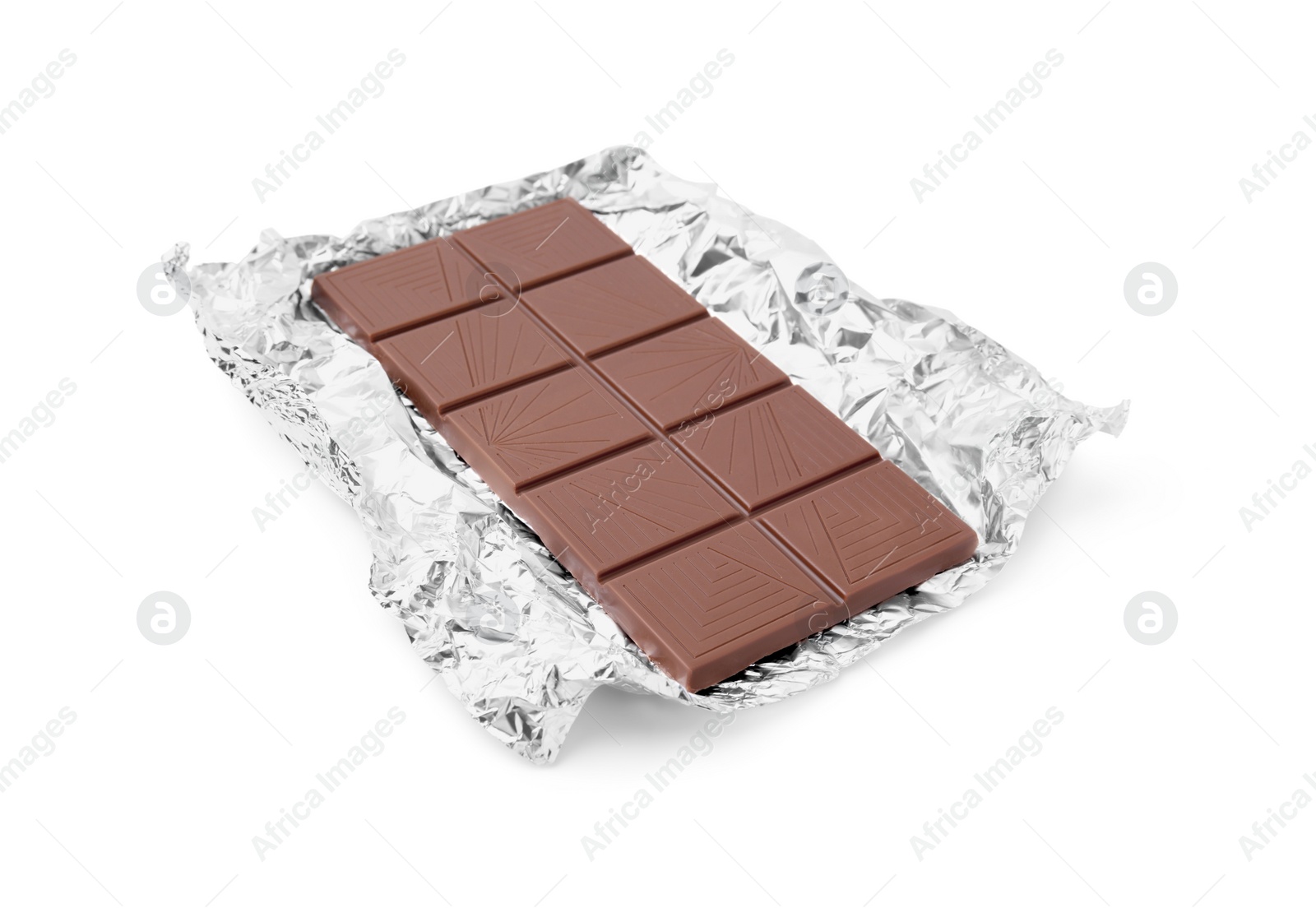 Photo of Delicious milk chocolate bar with foil isolated on white