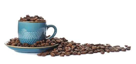 Cup and coffee beans on white background