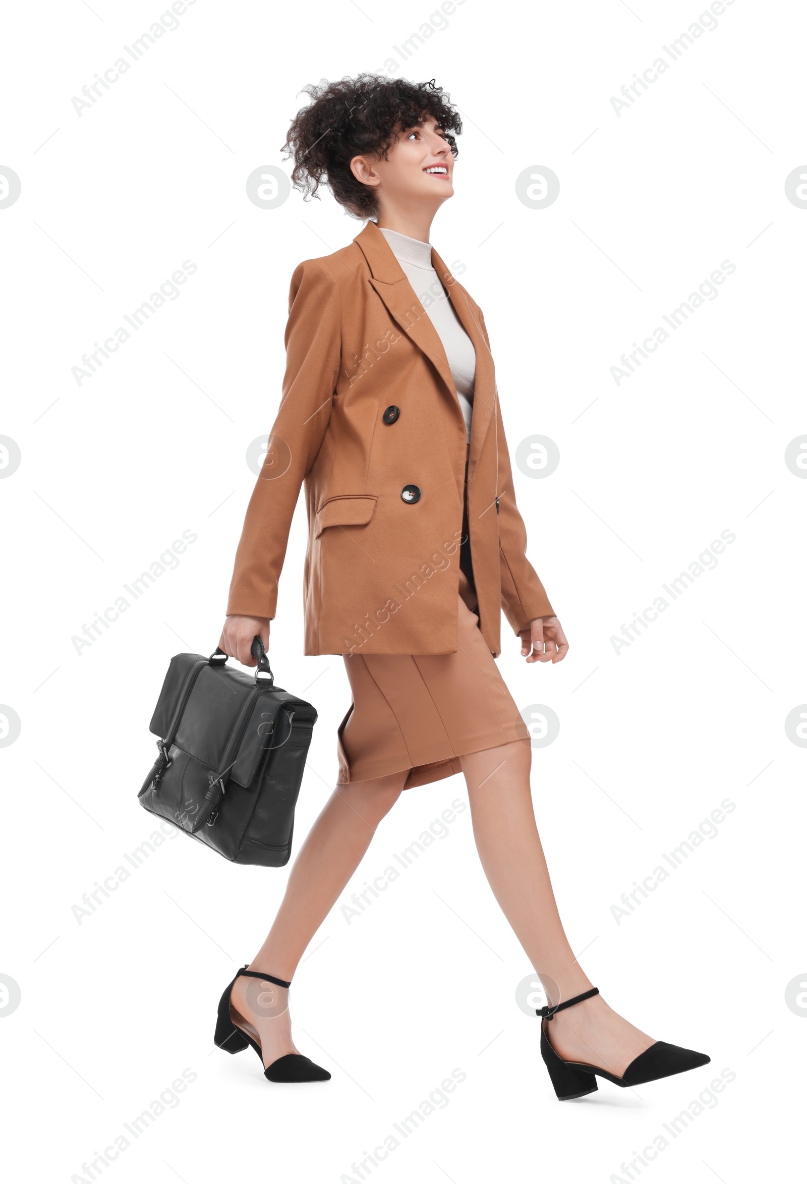 Photo of Beautiful businesswoman in suit with briefcase walking on white background