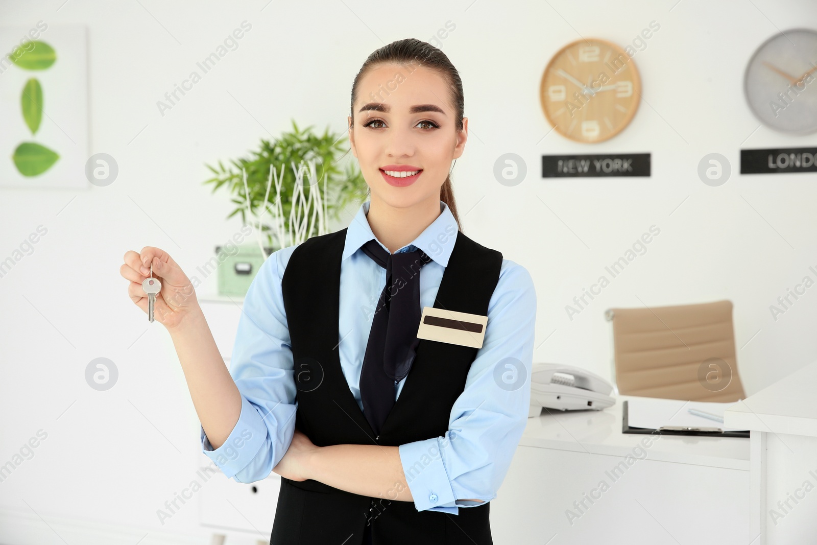 Photo of Portrait of female receptionist at workplace in hotel