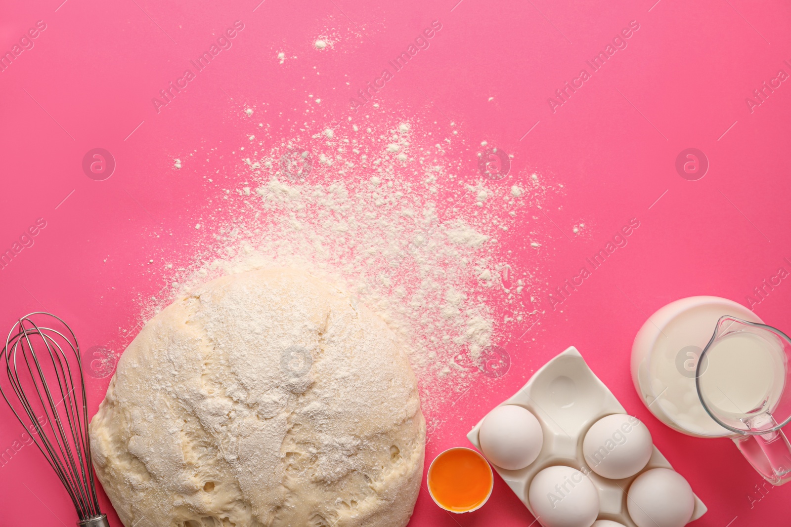 Photo of Raw dough and ingredients for pastries on pink background, flat lay. Space for text