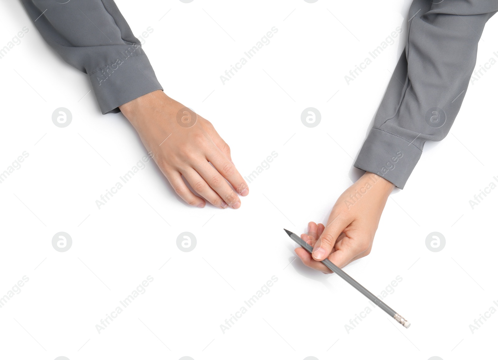 Photo of Woman with pencil on white background, top view. Closeup of hands