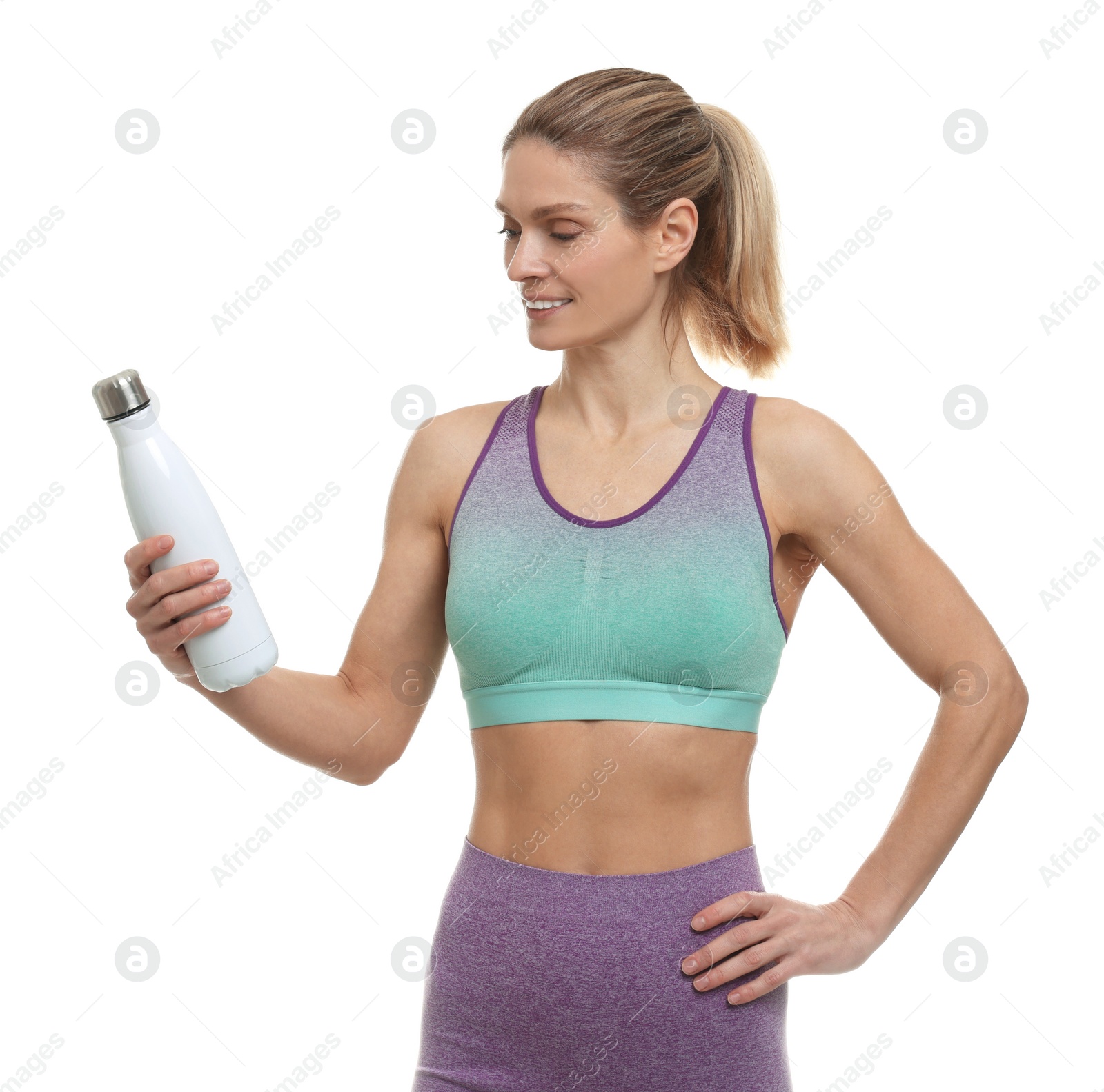 Photo of Portrait of sportswoman with thermo bottle on white background
