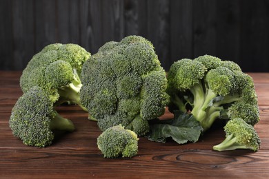 Fresh raw green broccoli on wooden table