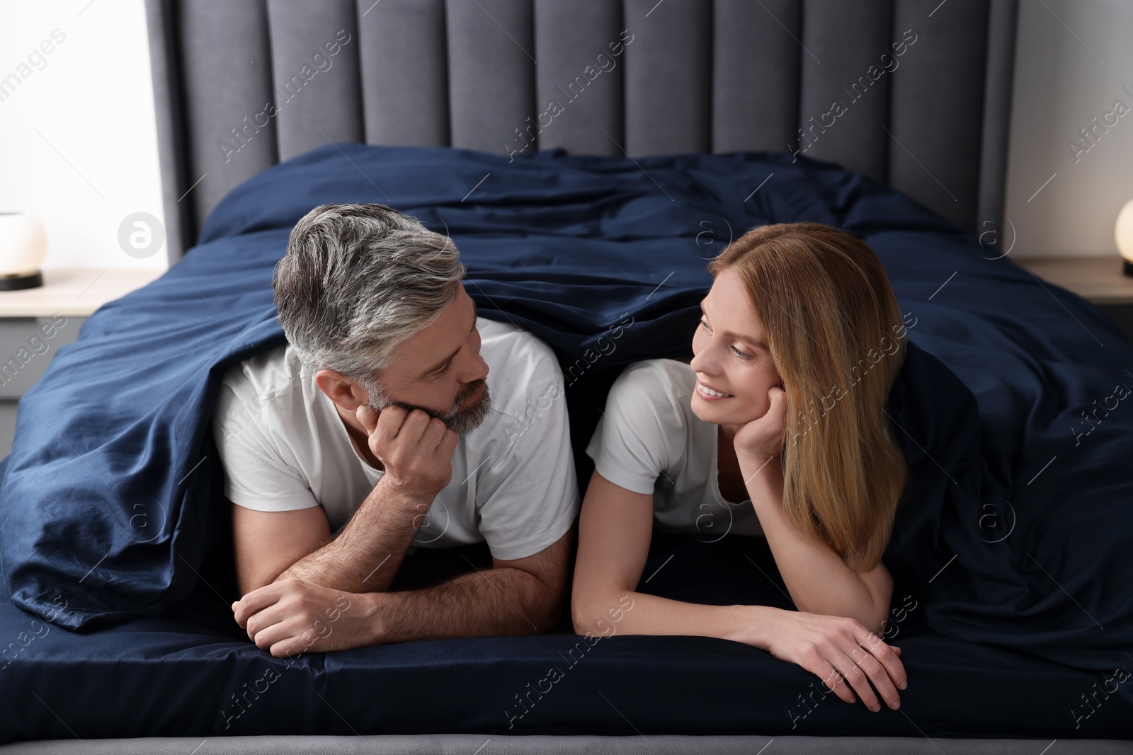 Photo of Lovely mature couple in bed at home