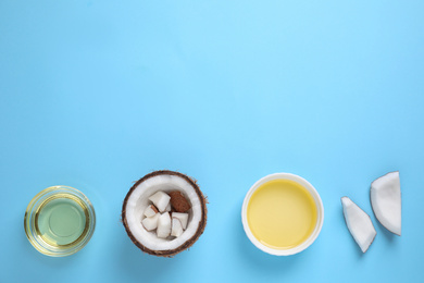 Flat lay composition with coconut oil on light blue background, space for text