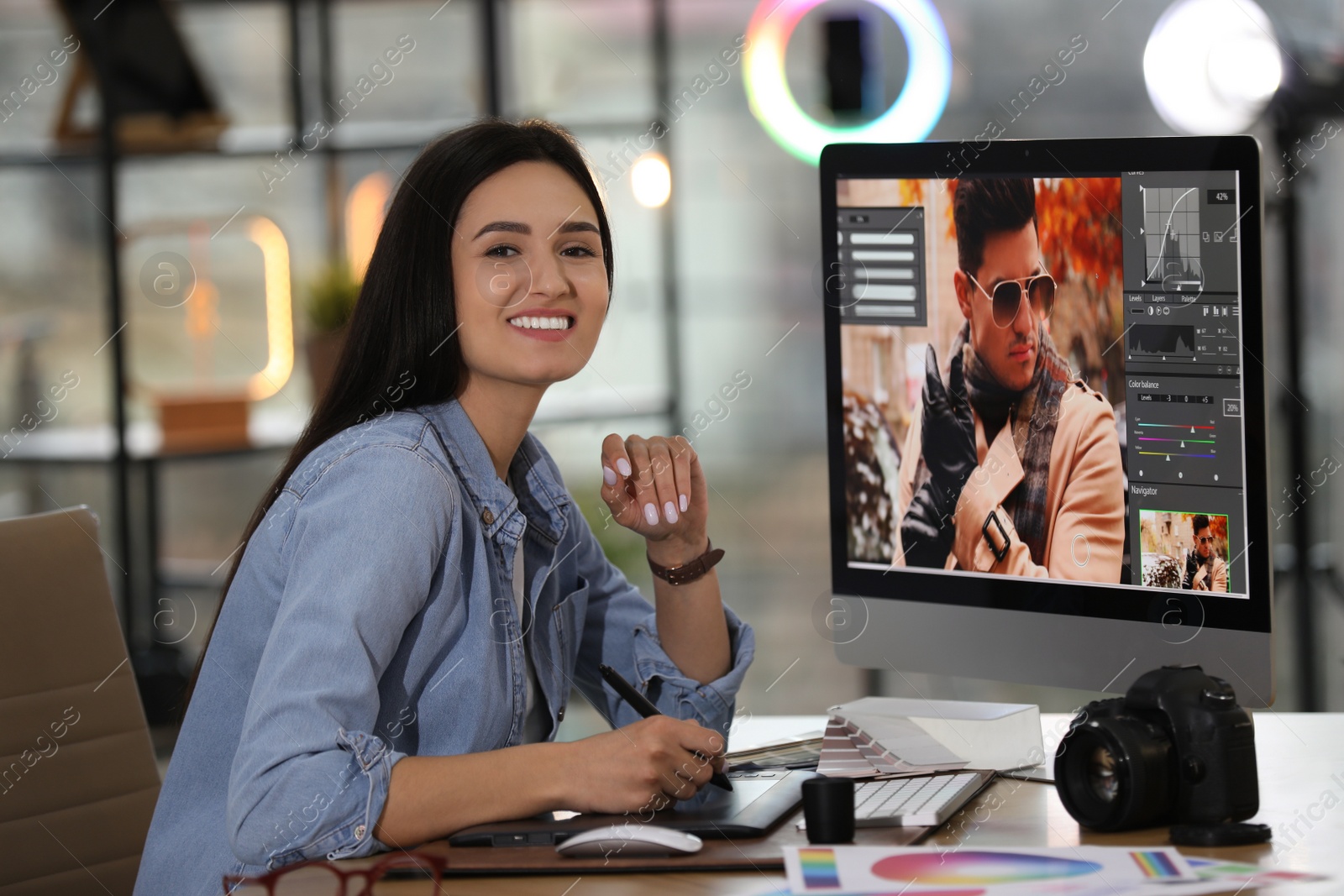 Photo of Professional retoucher working on computer in office