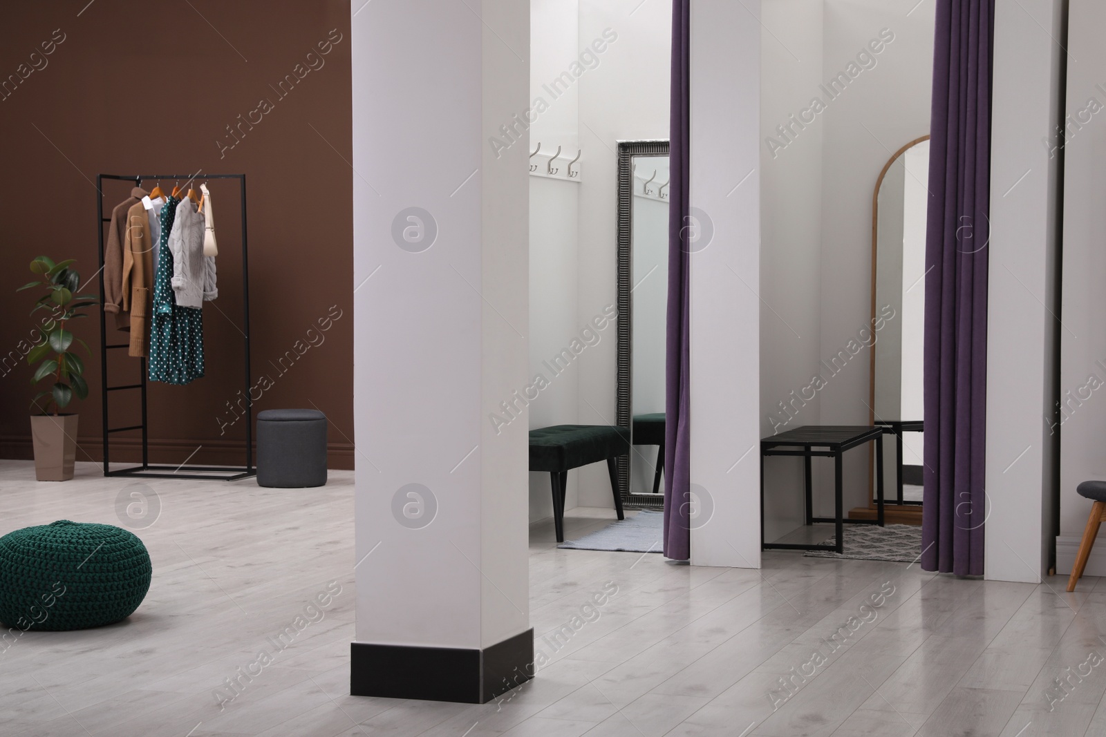 Photo of Empty dressing rooms in fashion store. Stylish interior