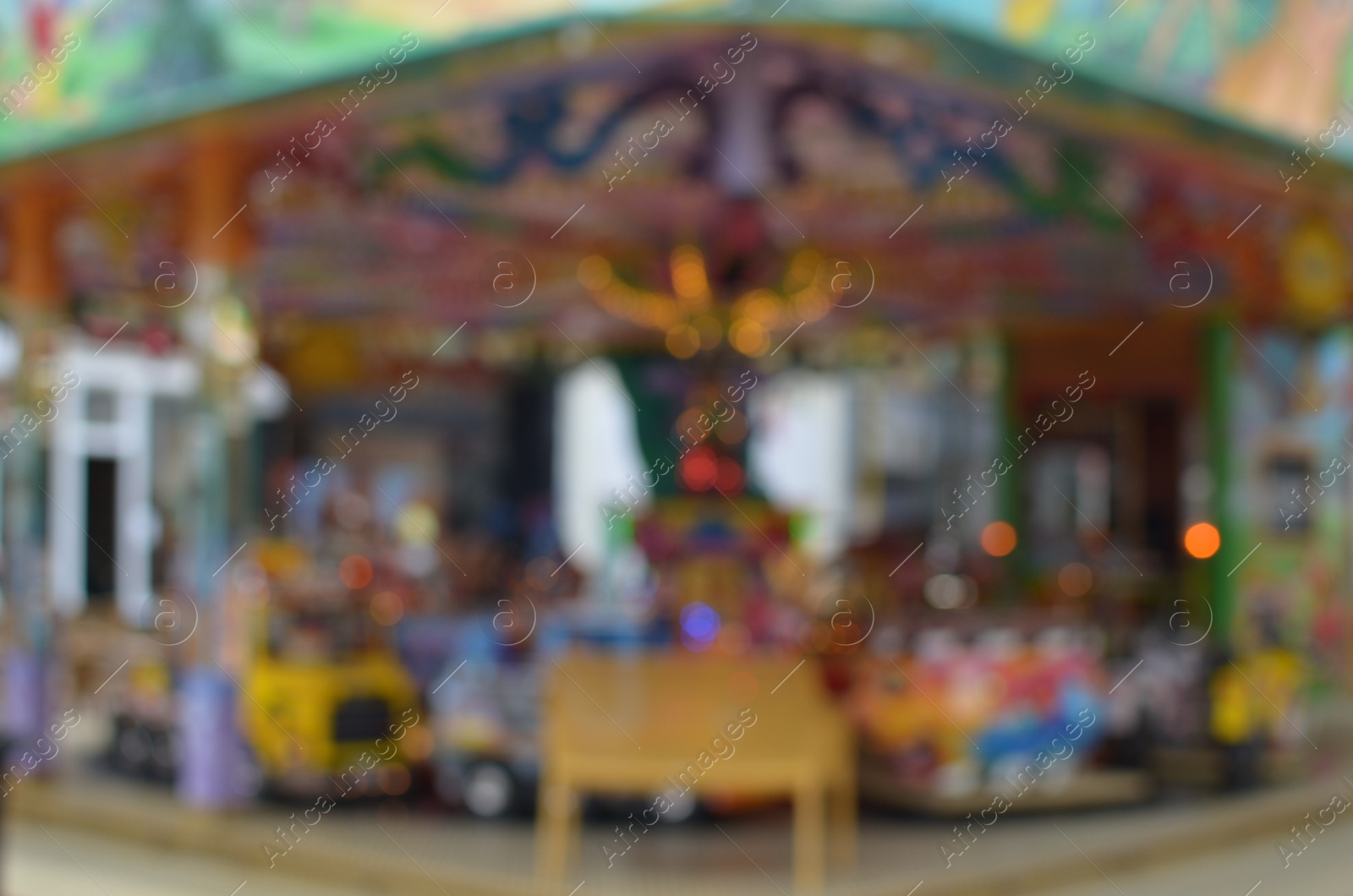 Photo of Blurred view of outdoor amusement park with different attractions