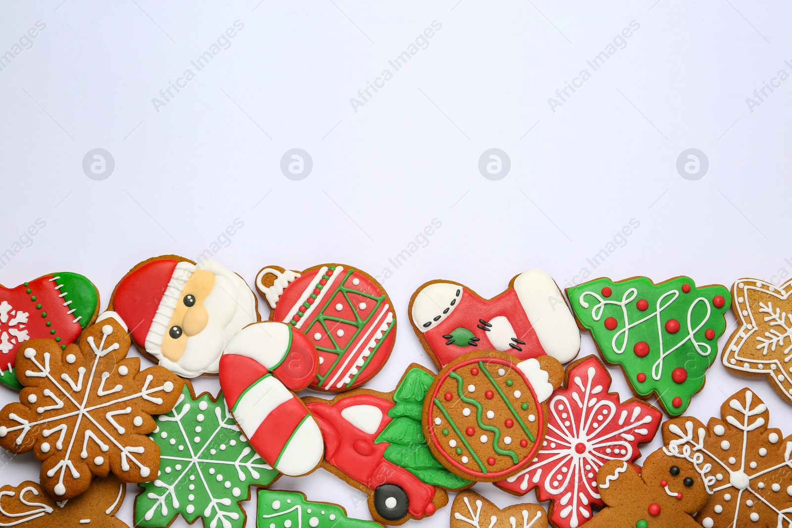 Photo of Different tasty Christmas cookies on white background, flat lay. Space for text