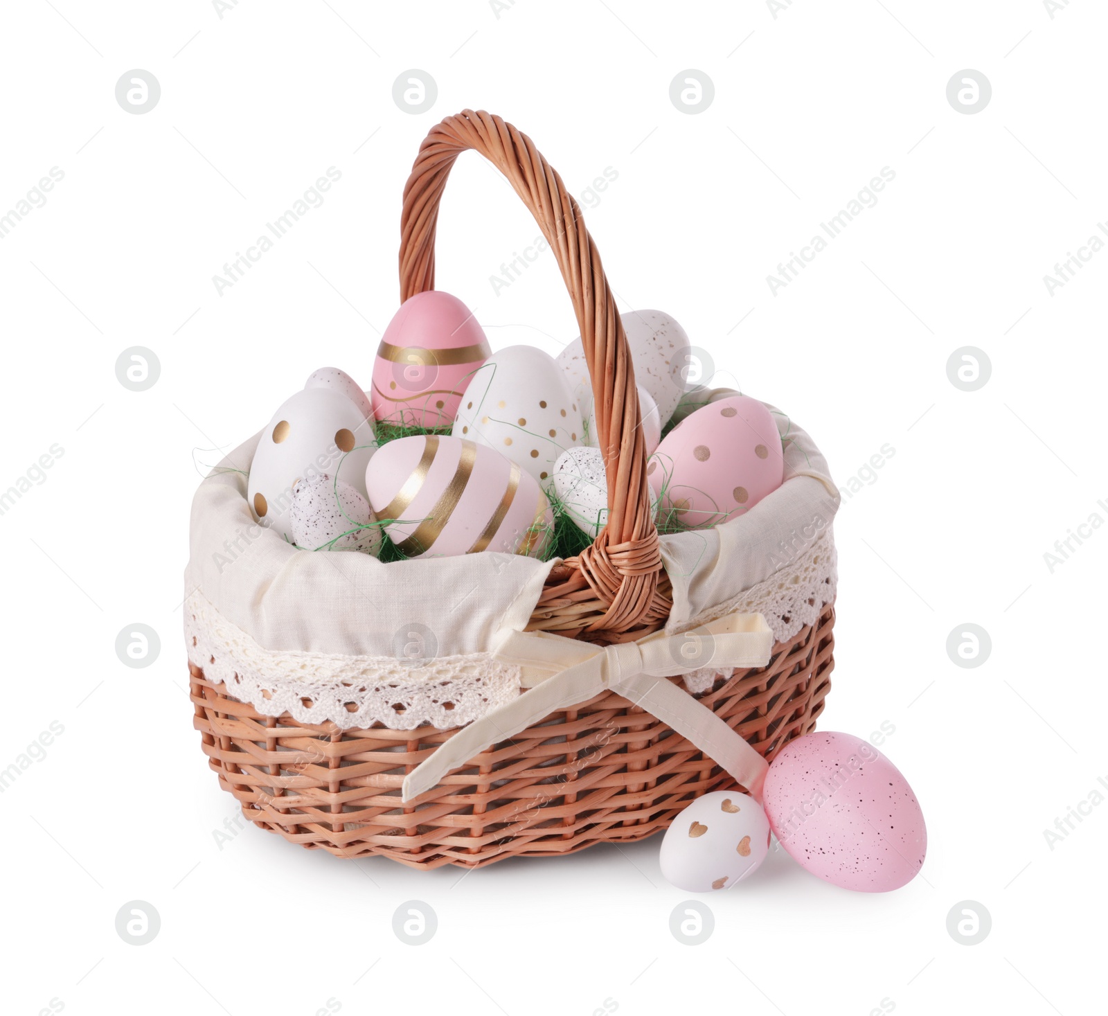 Photo of Wicker basket with beautifully painted Easter eggs isolated on white