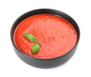 Photo of Delicious tomato cream soup isolated on white