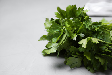 Photo of Fresh green parsley on table, closeup. Space for text