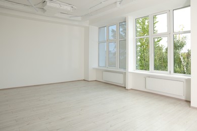 Photo of New empty room with clean windows and white walls