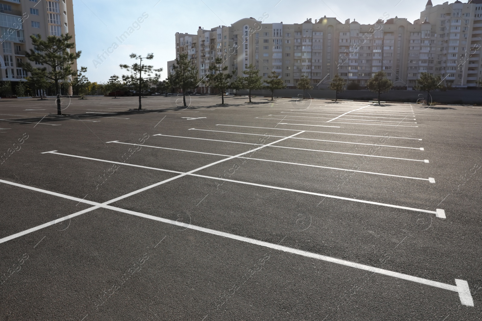 Photo of Car parking lot with white marking outdoors