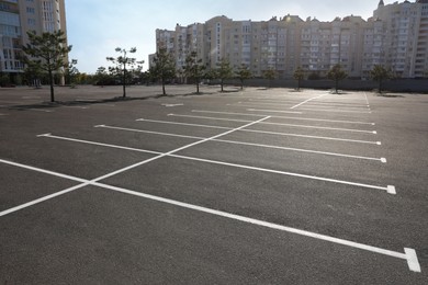 Car parking lot with white marking outdoors