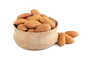 Wooden bowl and organic almond nuts on white background. Healthy snack