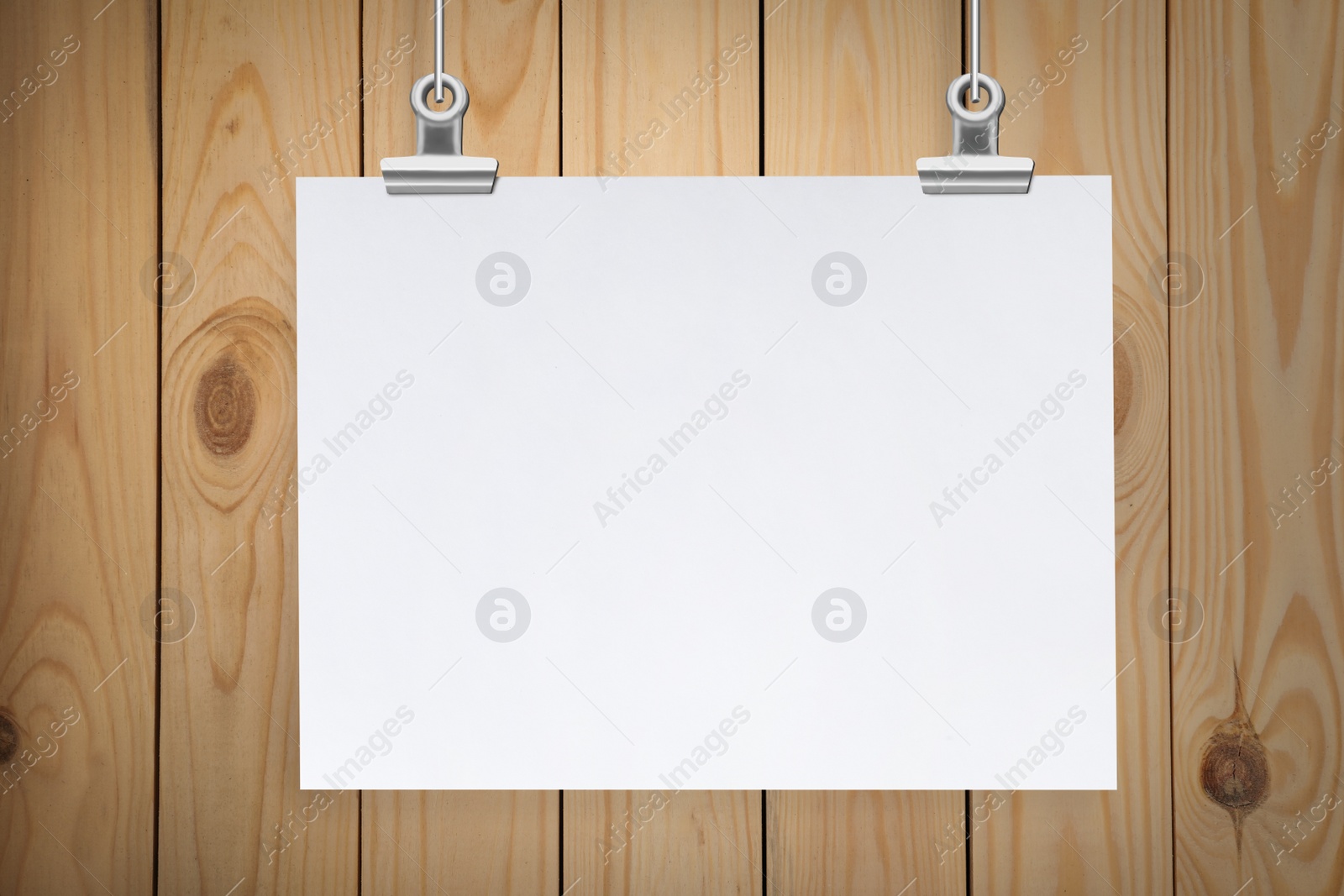 Image of Blank poster hanging near wooden wall. Space for design