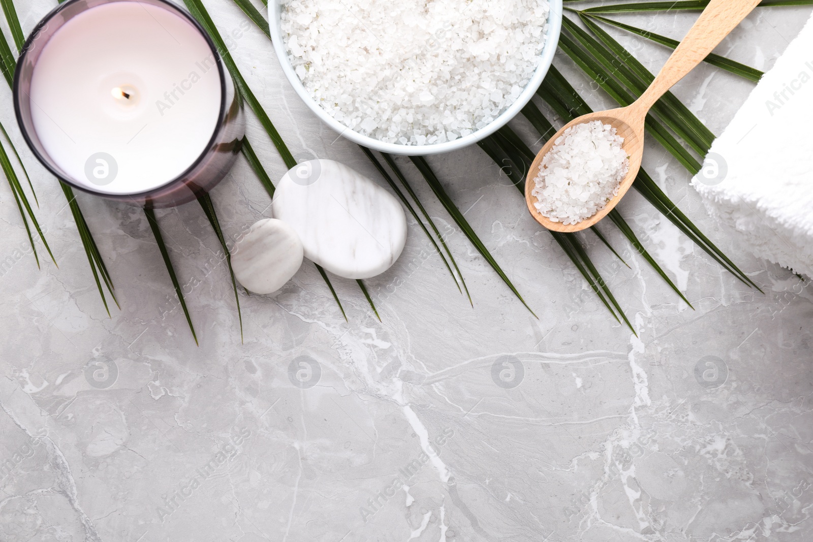 Photo of Flat lay composition with white sea salt on marble background, space for text. Spa treatment