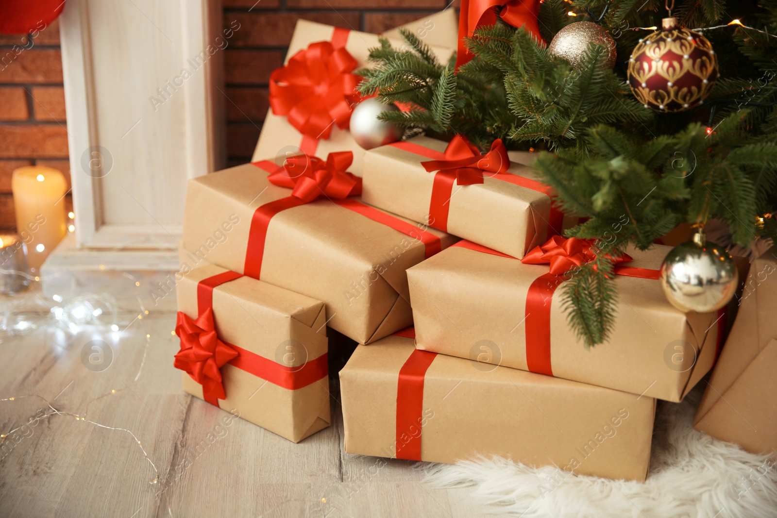 Photo of Beautiful Christmas tree and gift boxes indoors