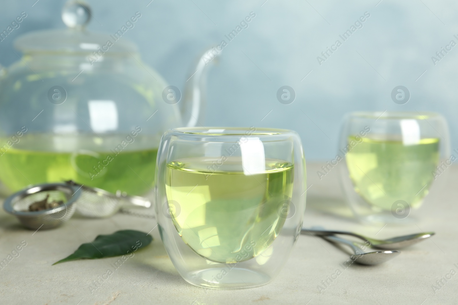 Photo of Fresh aromatic green tea on light table