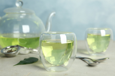 Fresh aromatic green tea on light table