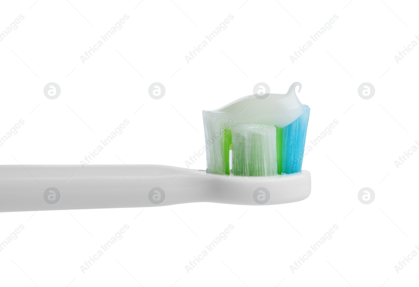 Photo of Electric toothbrush with paste on white background, closeup