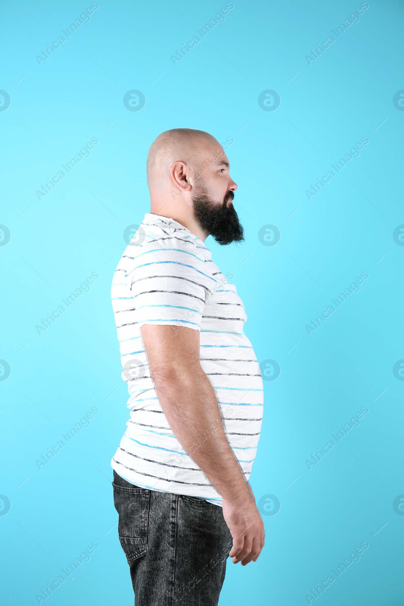 Photo of Fat man on color background. Weight loss