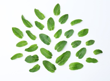 Flat lay composition with fresh green mint leaves on white background