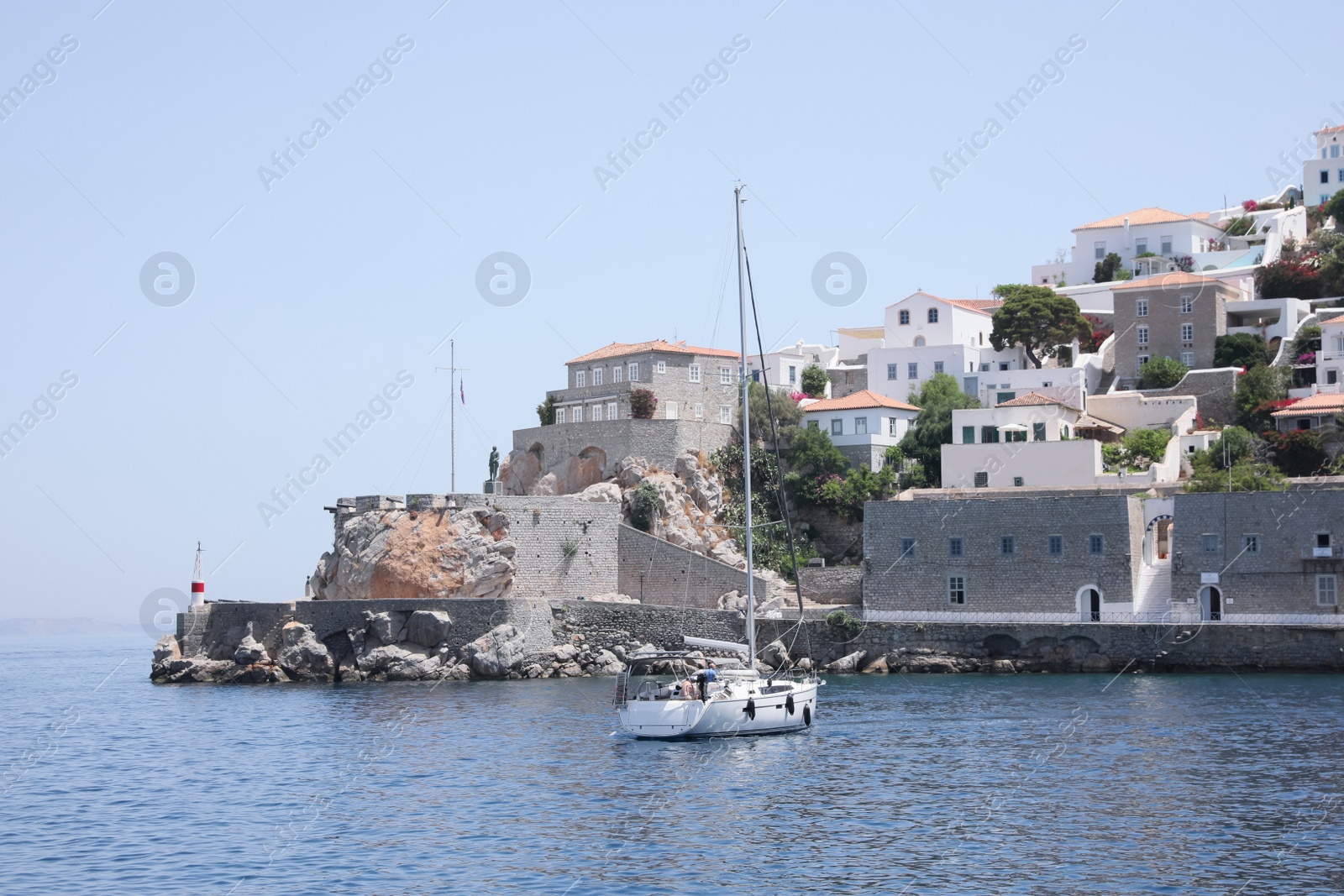 Photo of Beautiful view of sea with boat and coastal city