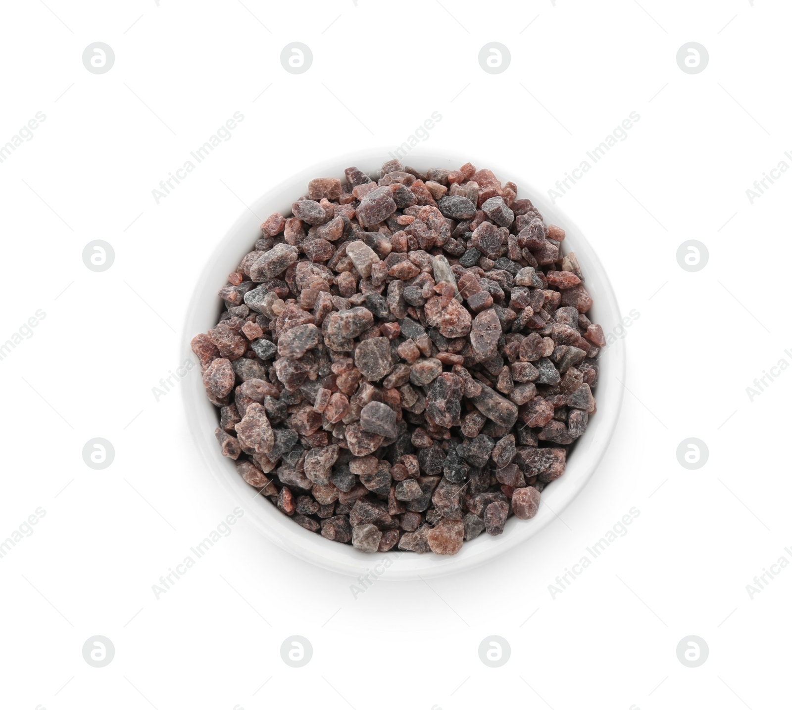 Photo of Bowl of Himalayan black salt isolated on white, top view