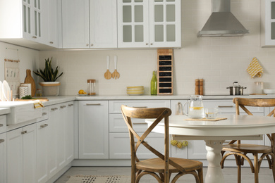 Photo of Elegant kitchen interior design with white round table