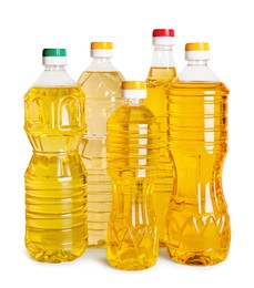 Photo of Bottles of cooking oil on white background