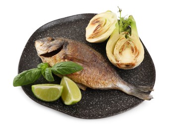 Photo of Delicious roasted dorado fish with fennel, lime and basil isolated on white