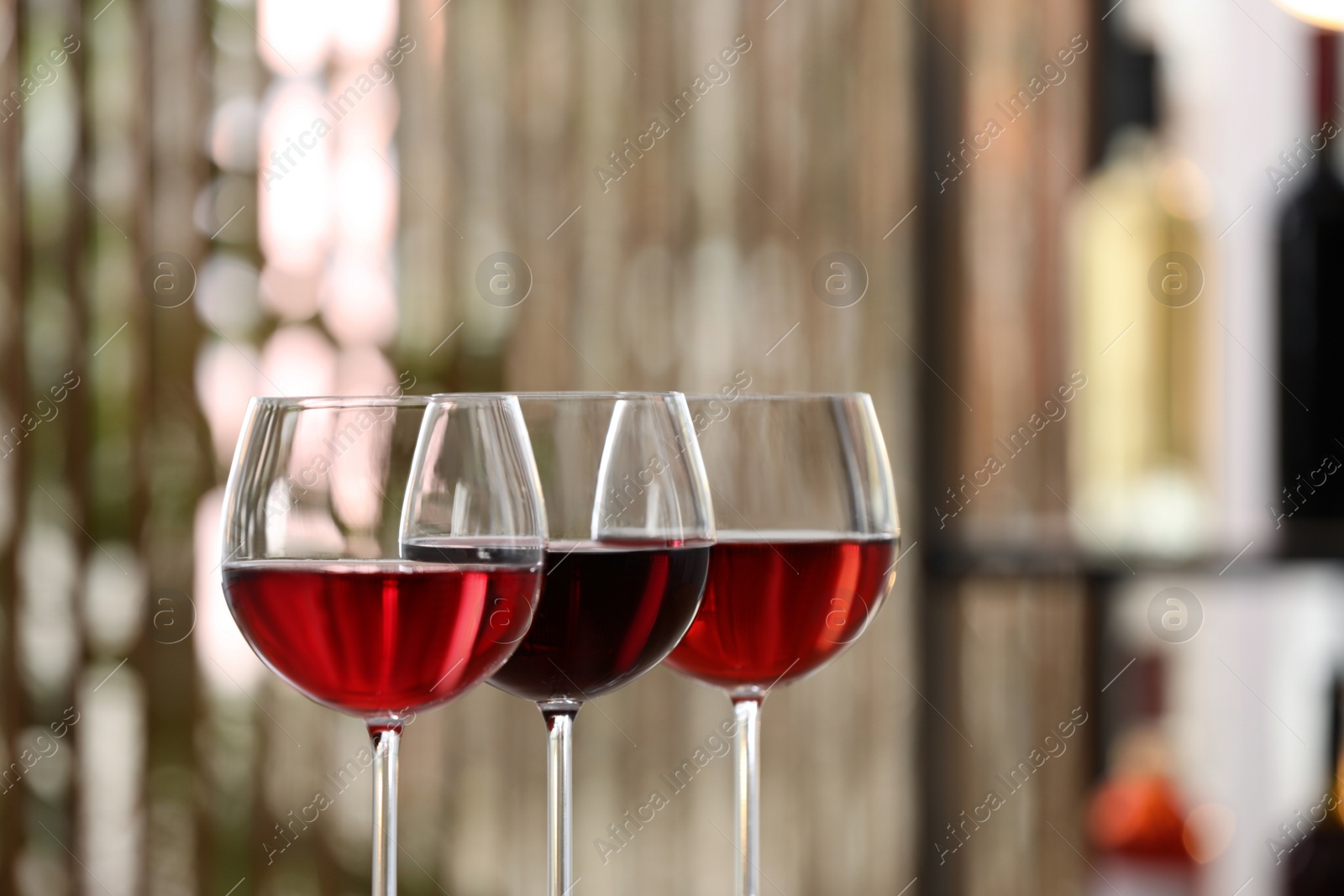 Photo of Different sorts of wine in glasses indoors, closeup