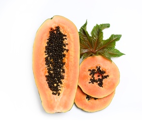 Photo of Fresh juicy cut papaya with leaf on white background, top view