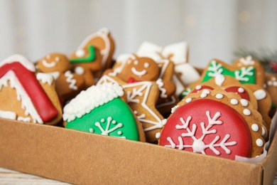 Photo of Box with tasty homemade Christmas cookies, closeup