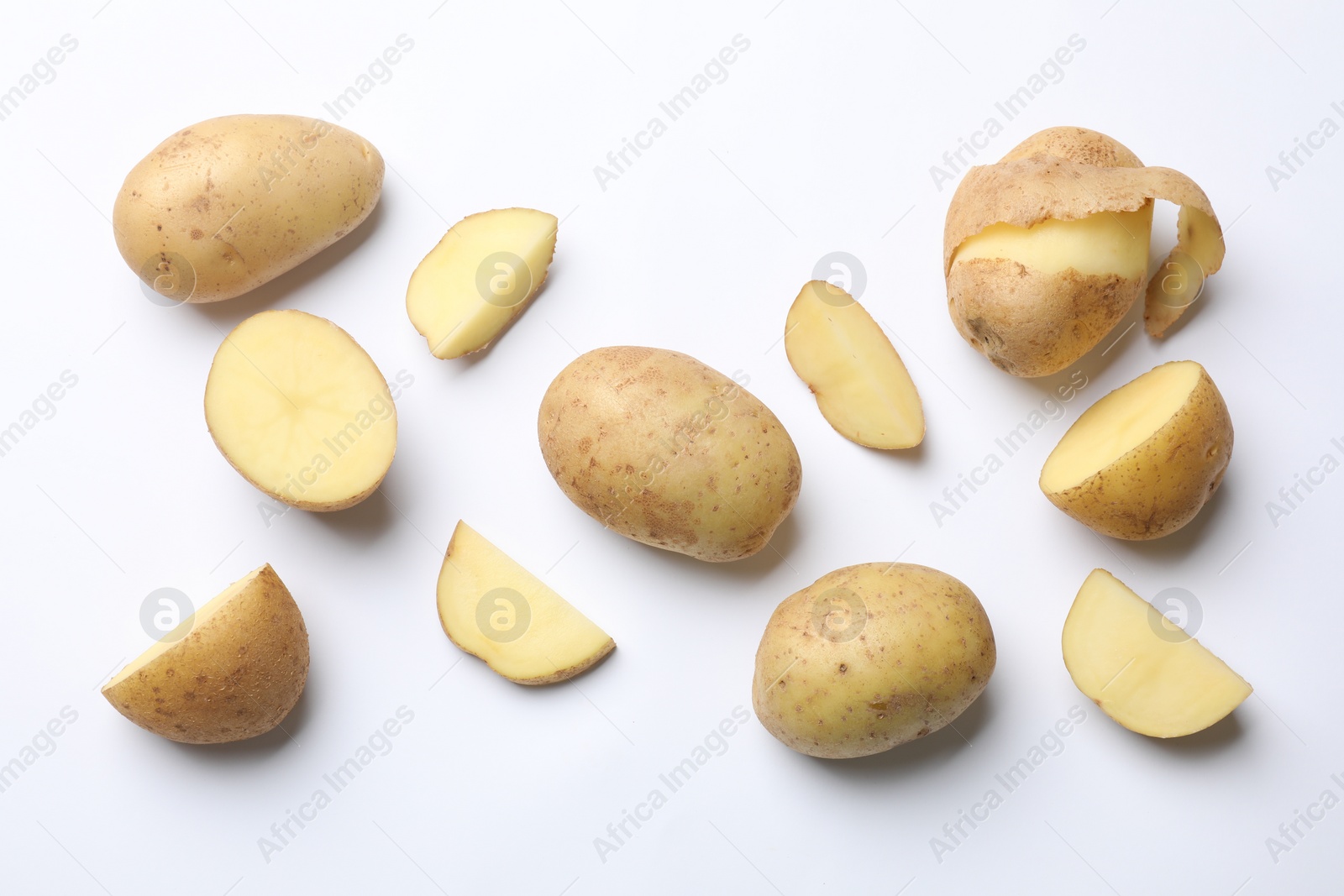 Photo of Fresh raw potatoes on white background, flat lay