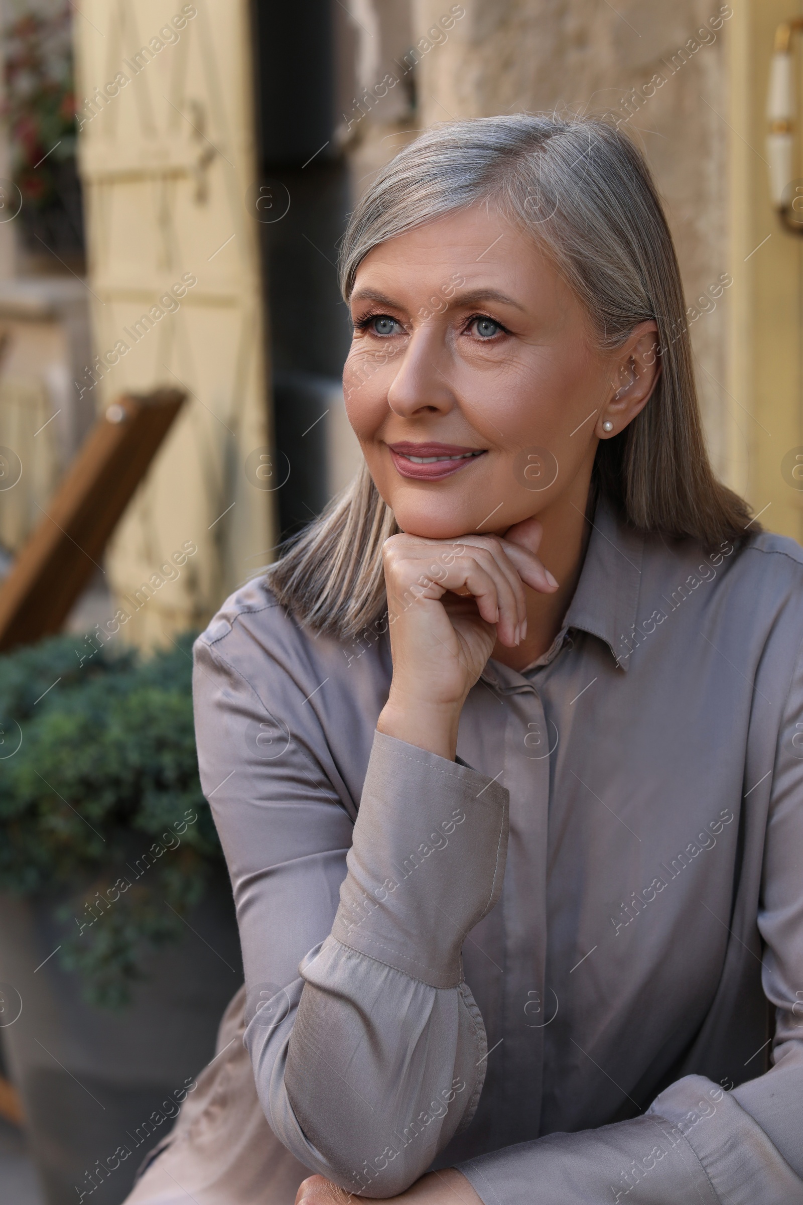 Photo of Portrait of beautiful happy senior woman outdoors