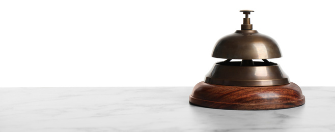 Hotel service bell on marble table against white background