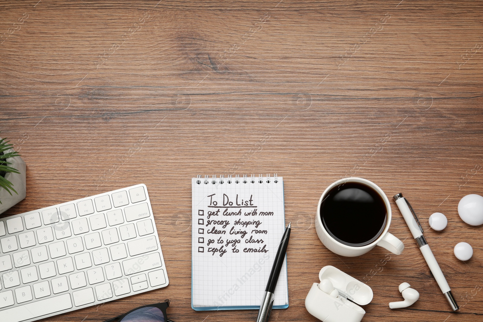 Photo of Flat lay composition with to do list on wooden table, space for text