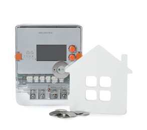 Photo of Electricity meter, house model and coins on white background