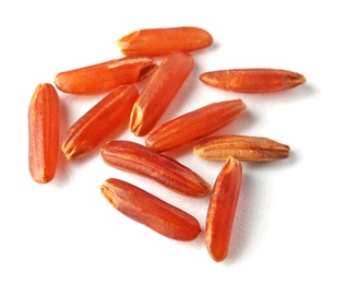 Photo of Uncooked brown rice on white background, closeup view